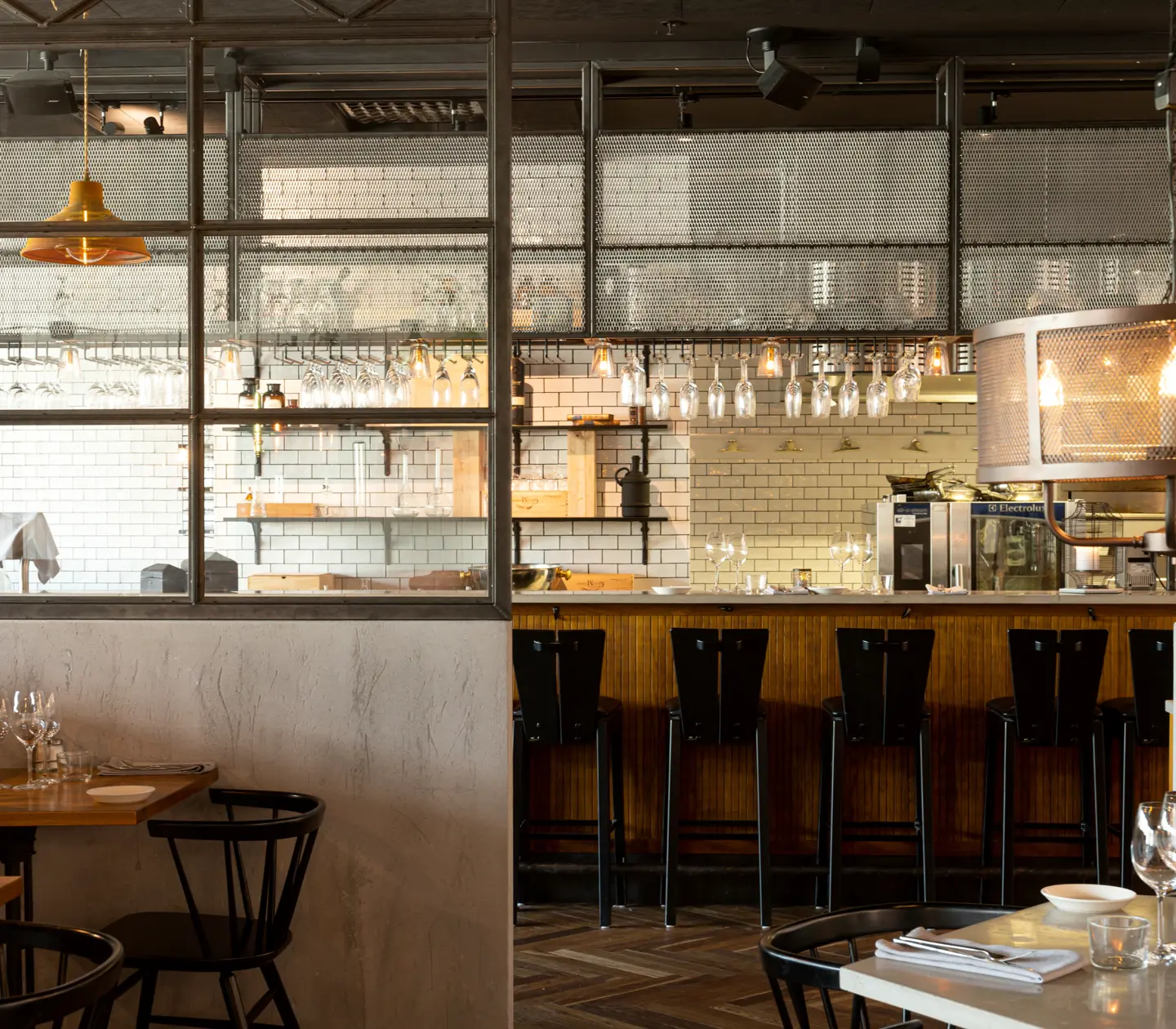 Restaurant environment with dining groups and bar