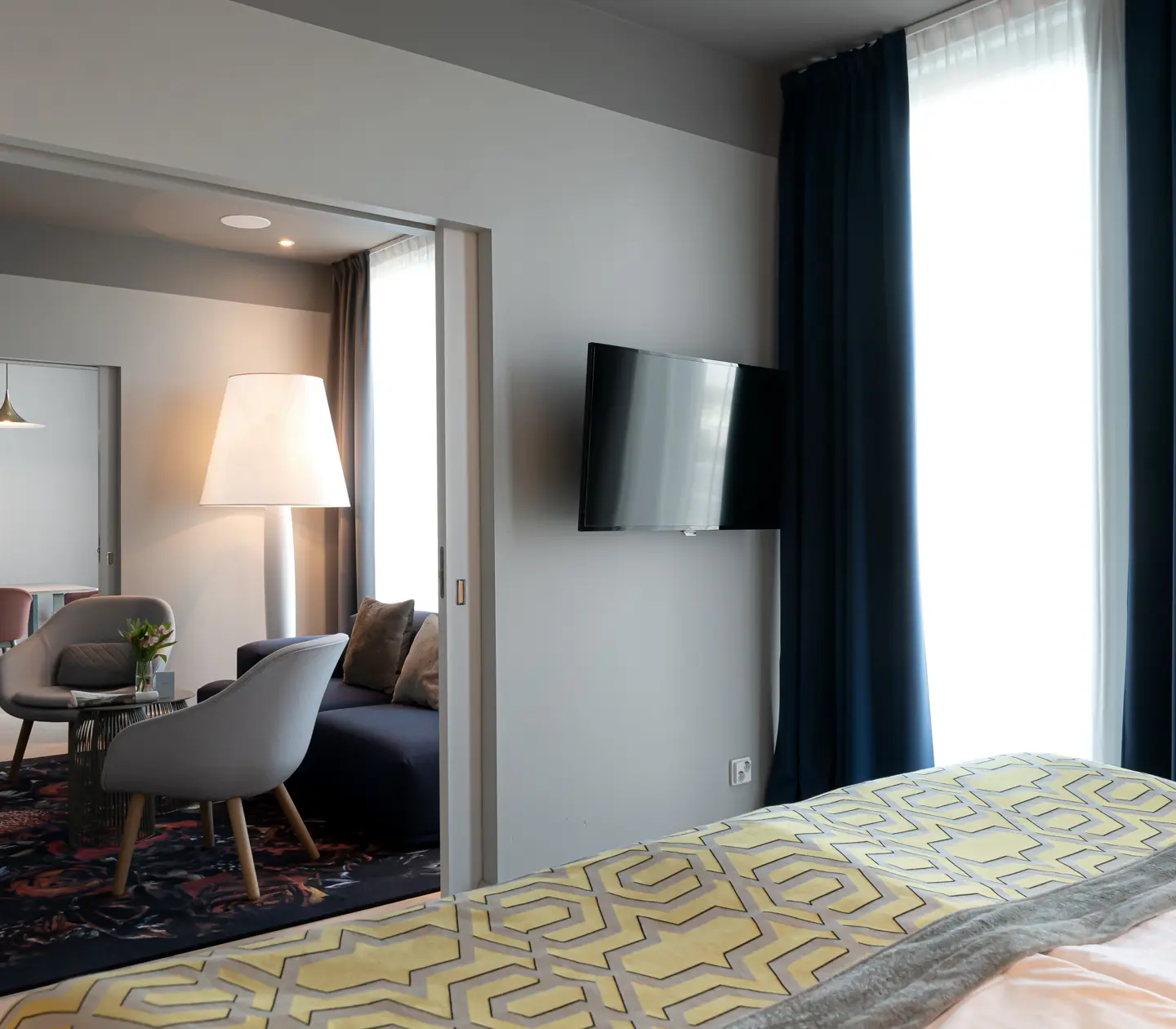 Cozy suite with dining area, sofa area and large floor lamp