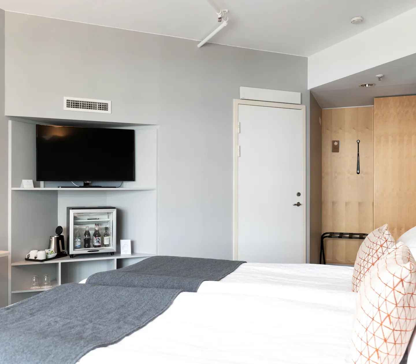 Hotel room with double bed and TV