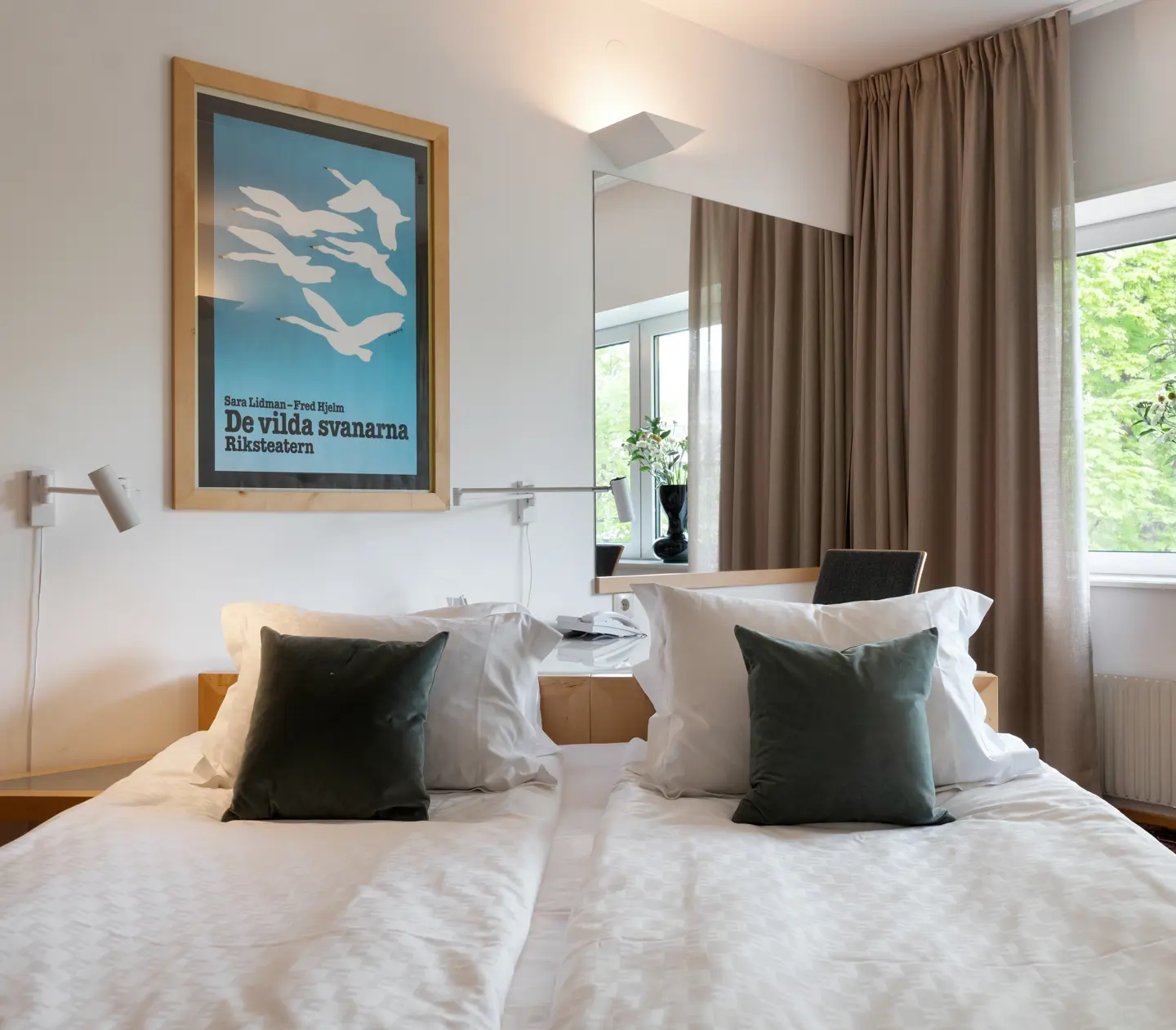 Hotel room with double bed, window and mirror