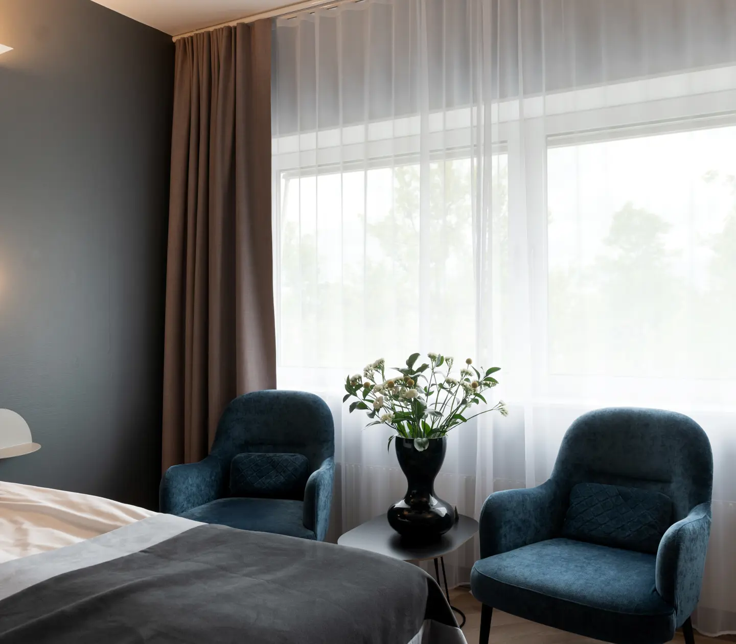 Cozy hotel room with armchairs and window