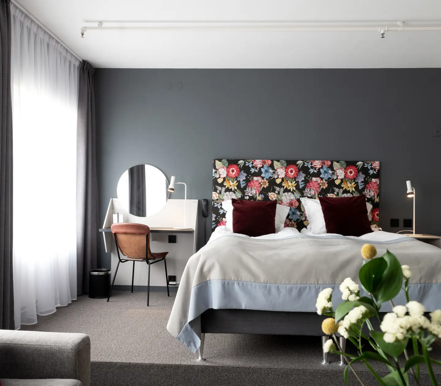 Hotel room with double bed and desk
