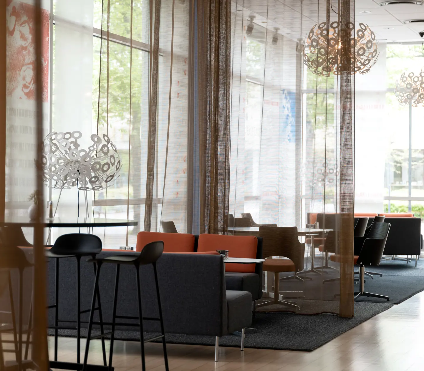 Hotel lobby with lounge chairs and large windows