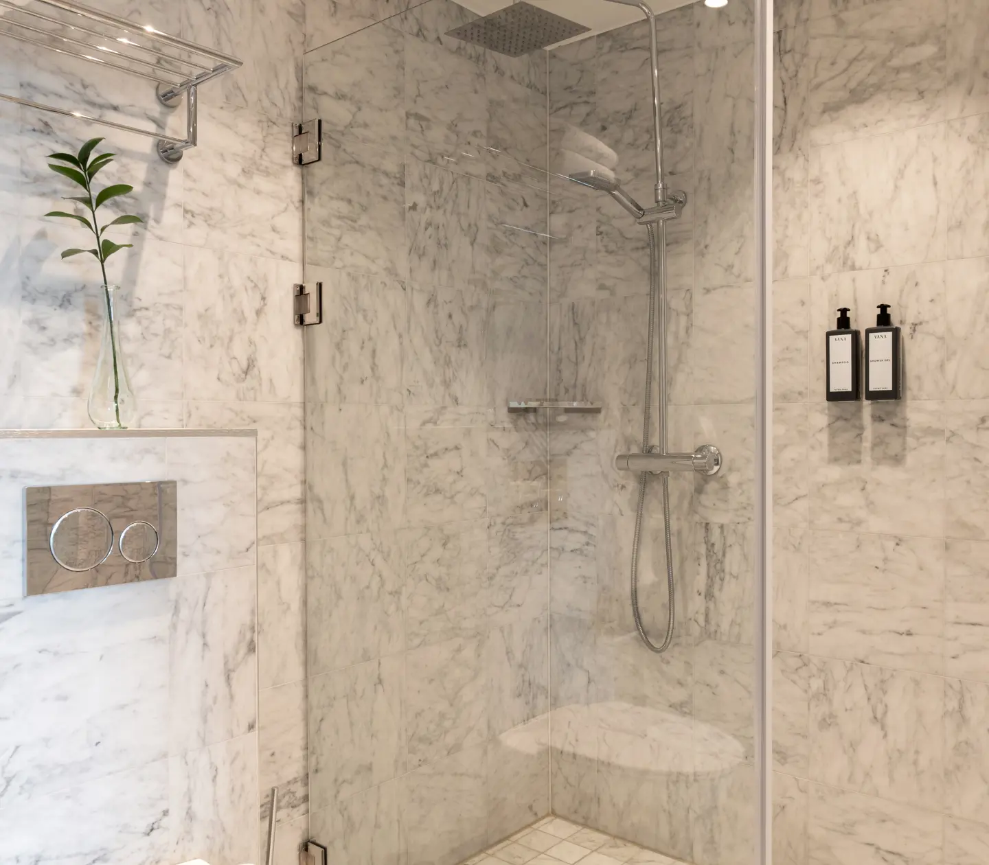 Bathroom with shower and marble tiles