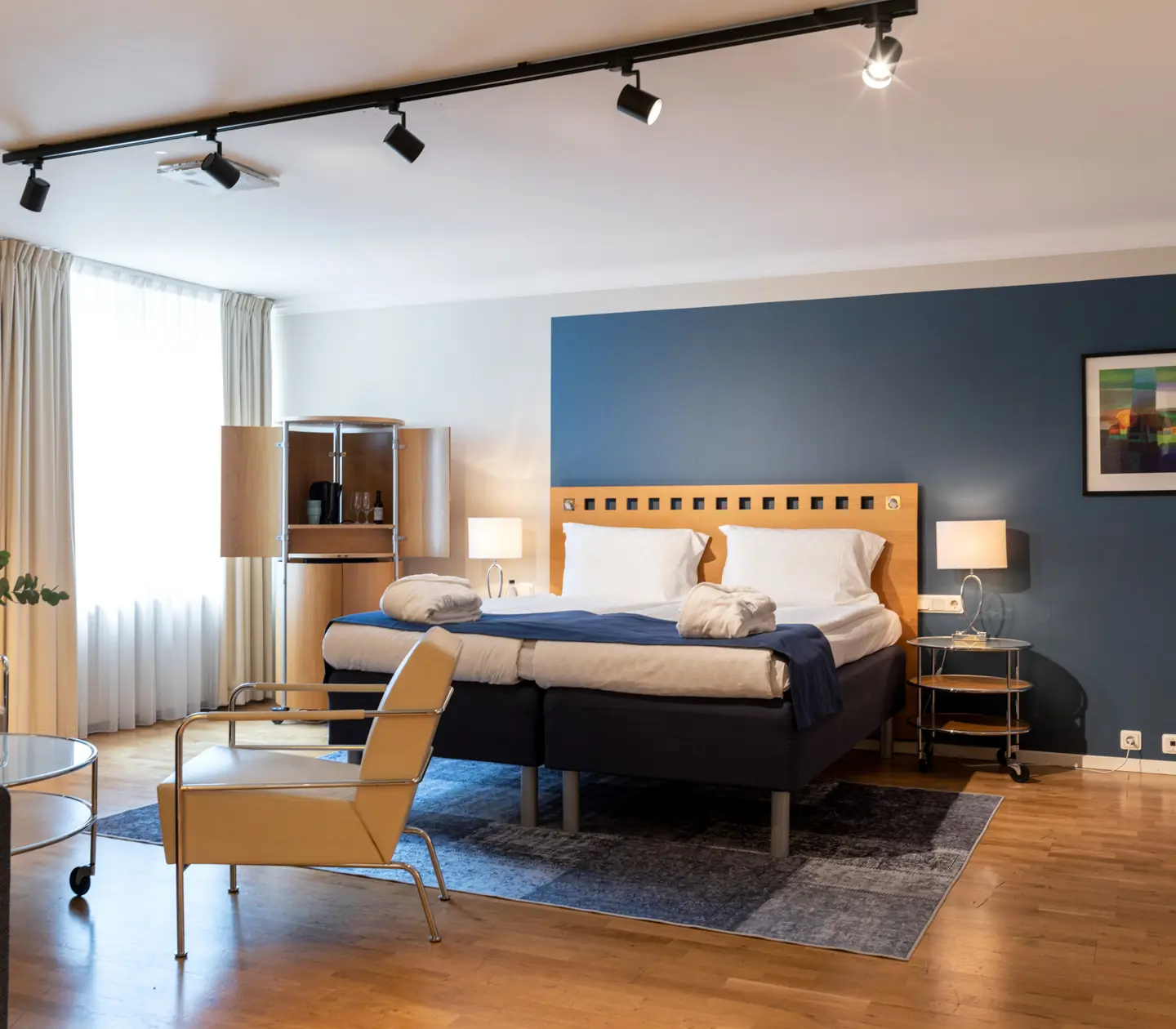 Hotel room with double bed, window and TV