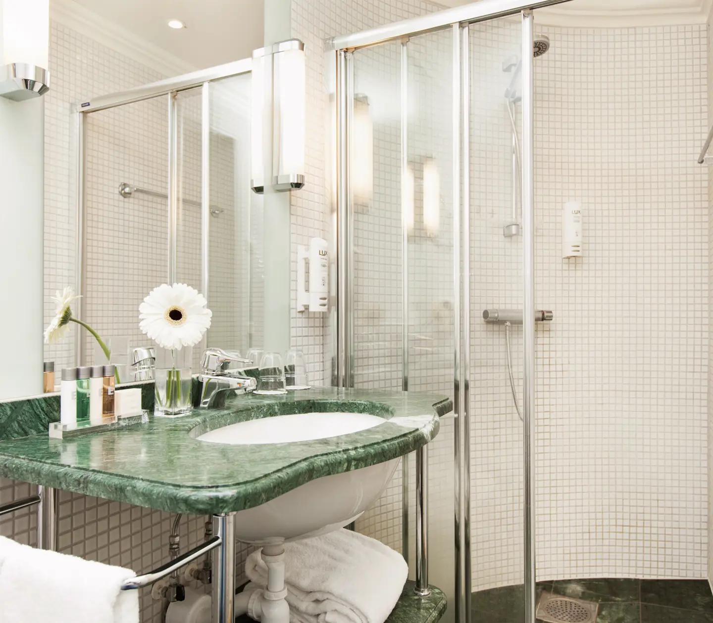 Bathroom with green sink and shower