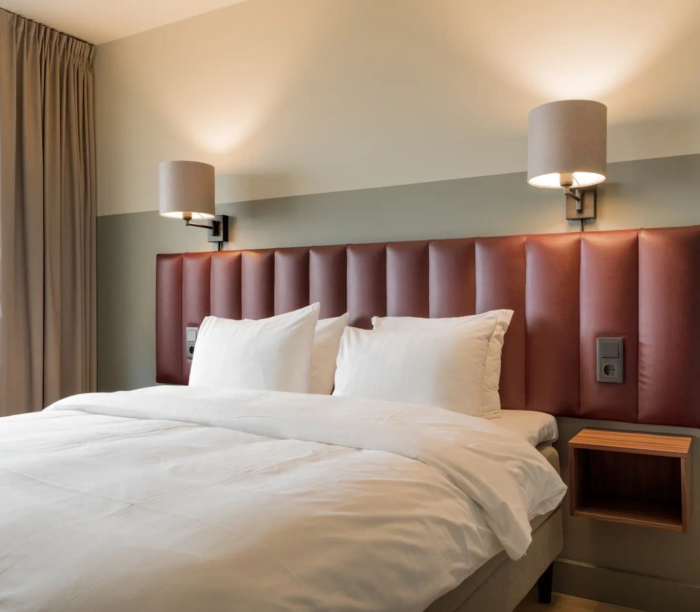 Double bed with red headboard