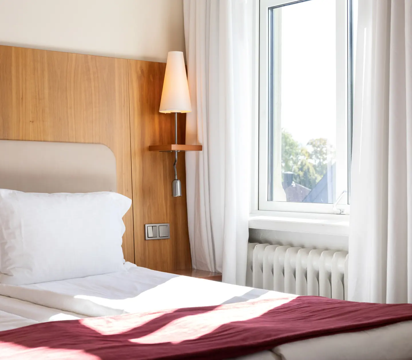 Close-up of double bed and window