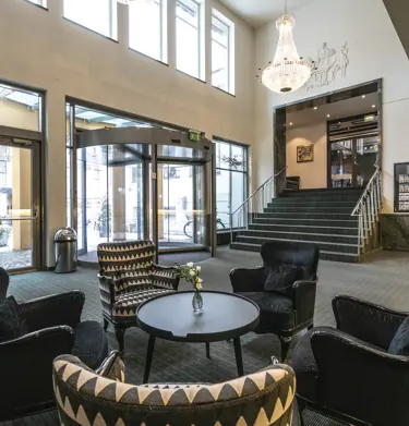 Hotel lobby with armchairs and stairs