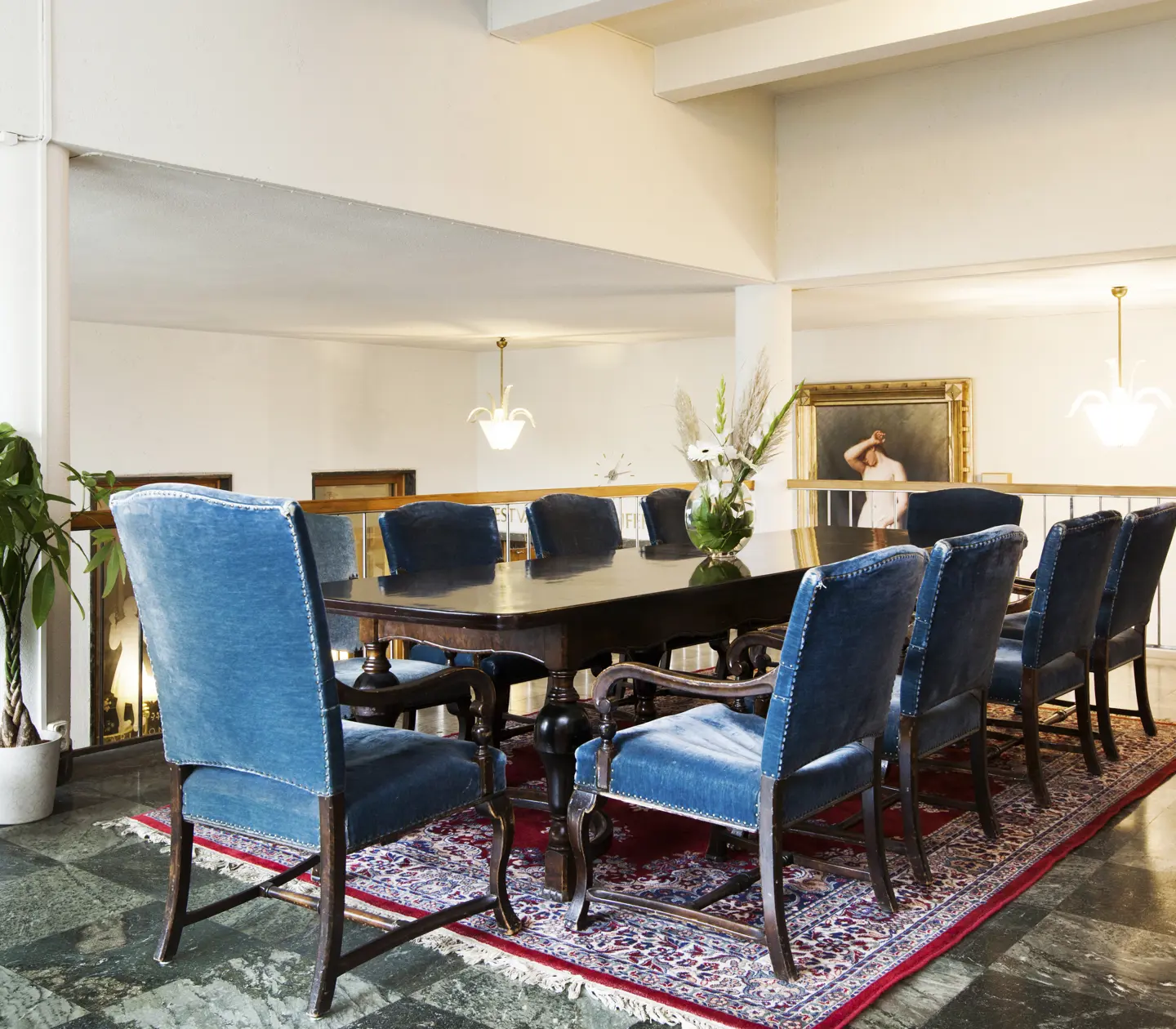 Pompous conference room with high ceiling and blue armchairs