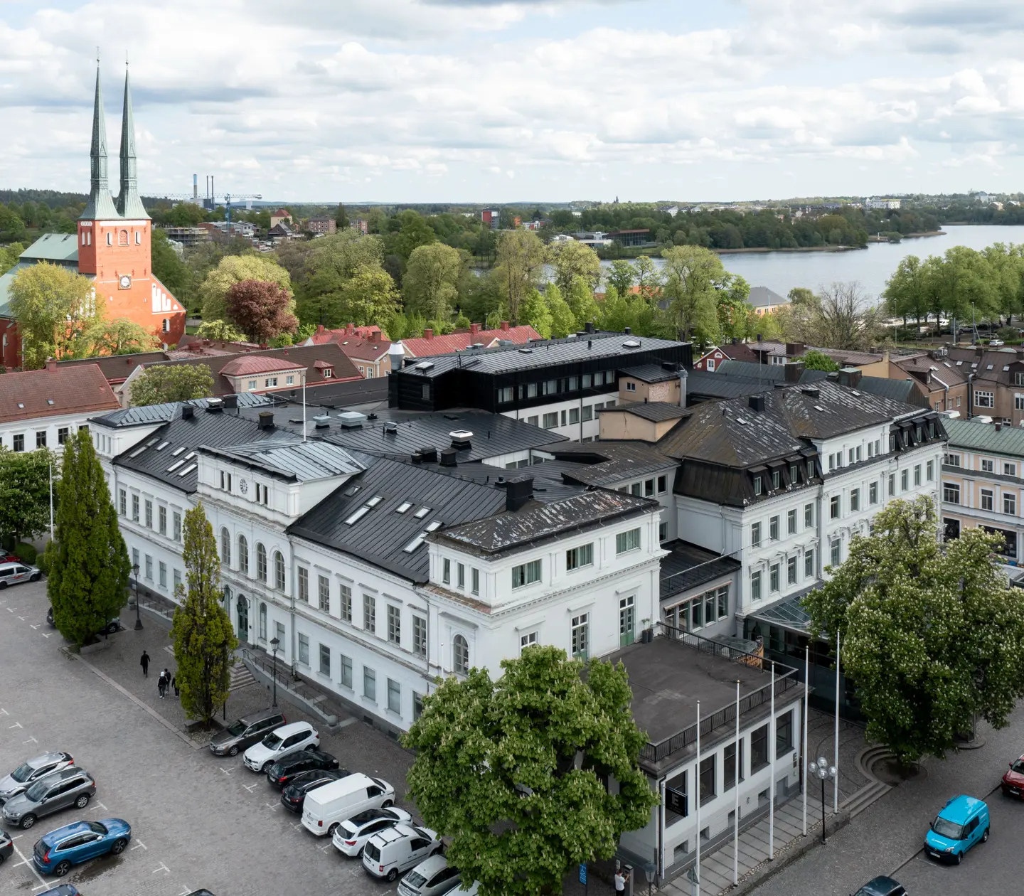 Hotel photographed from above with water in the background
