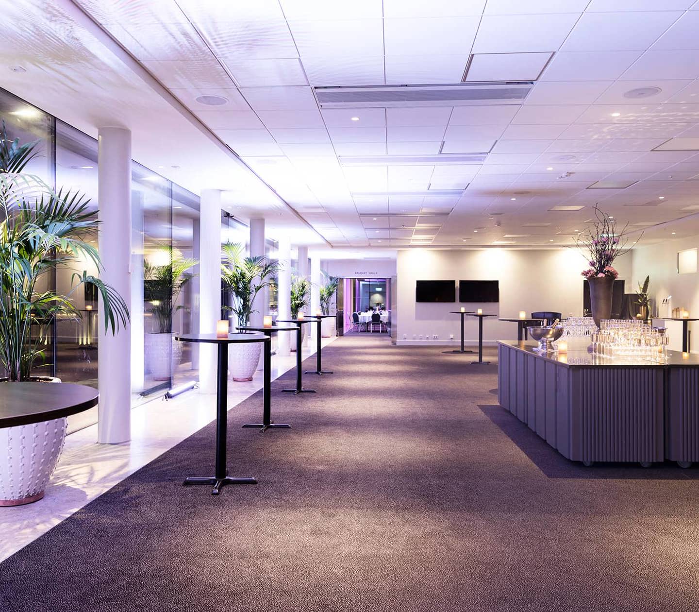 A spacious lobby with high tables