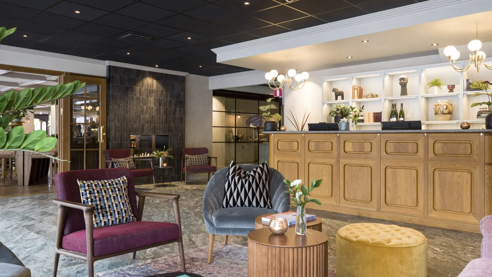 Elegant and inviting hotel lobby with trendy decor and comfortable seating in Borlänge, Sweden.
