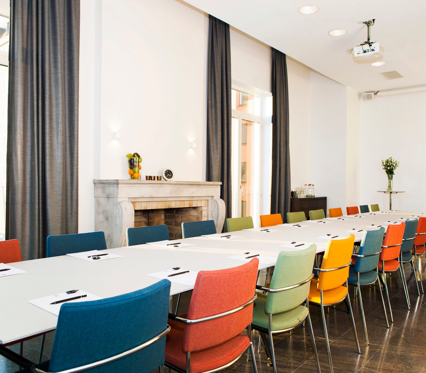 Conference table with colourful chairs