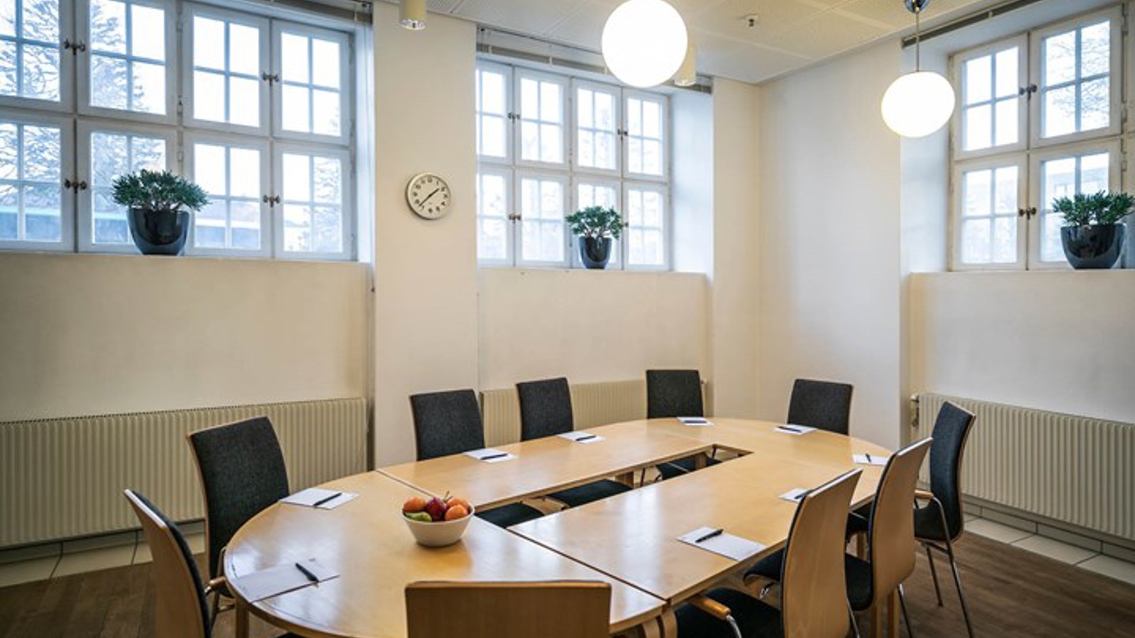 Conference room with board seating and large windows