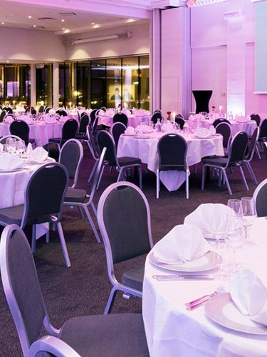 Large wedding venue at Elite Hotels with many tables and chairs