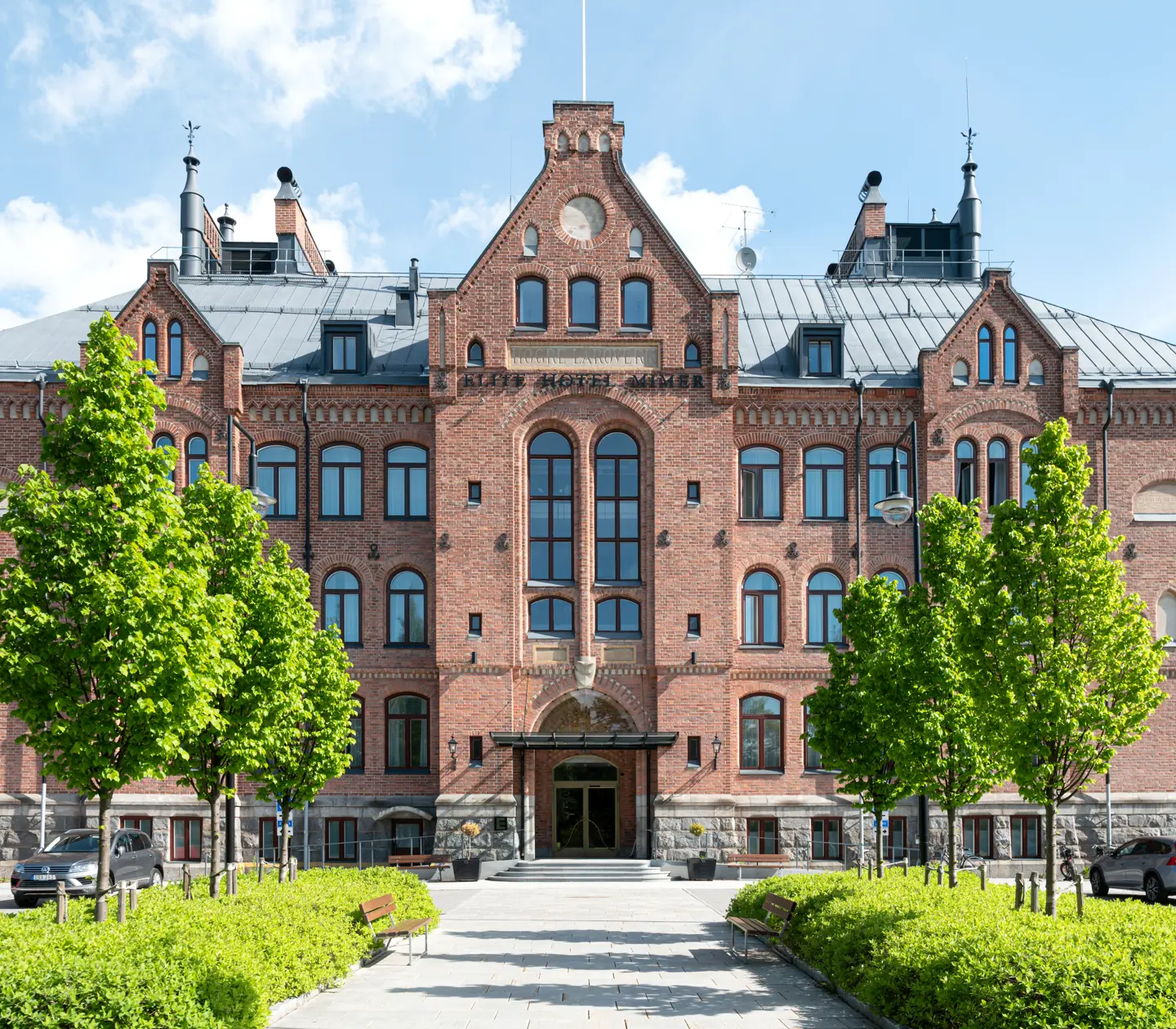 A large castle building in brown-red brick