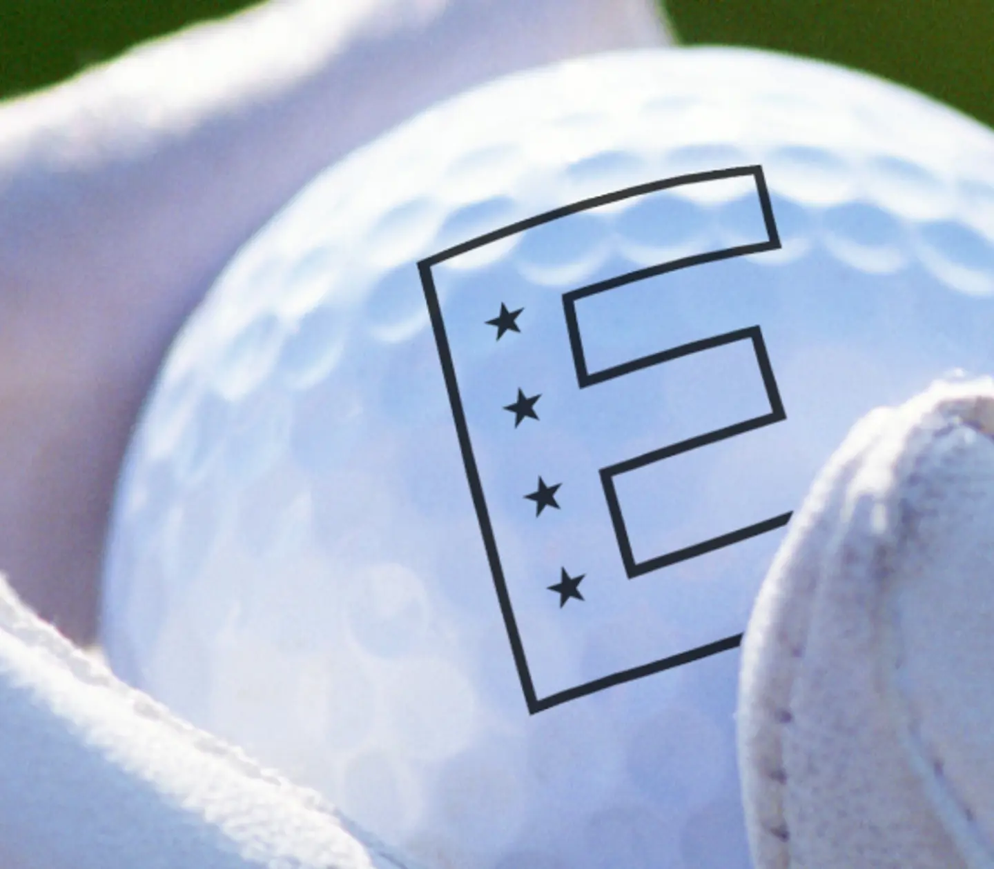 Hand holding a golf ball