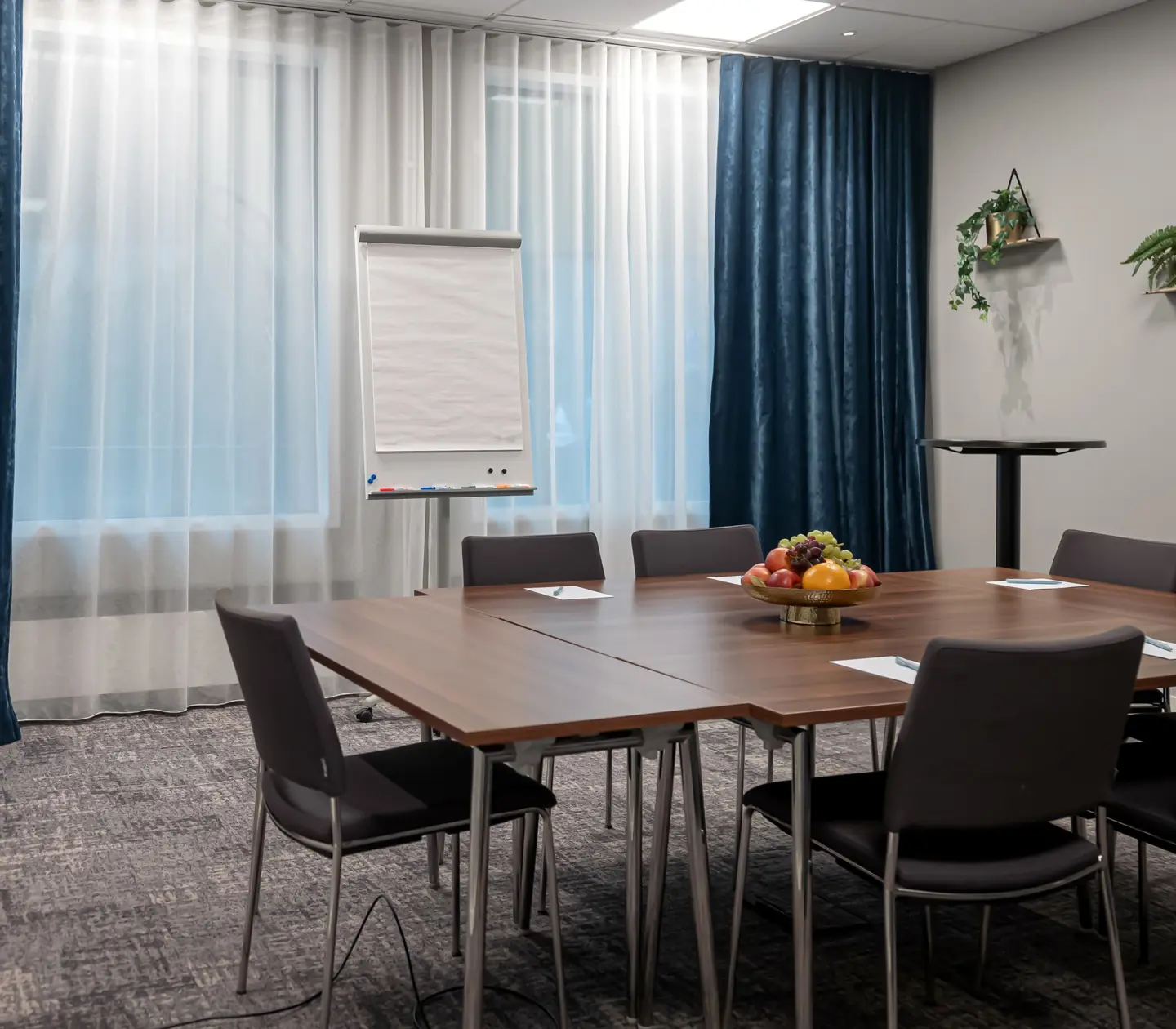 A modern conference room on a high floor with a nice view