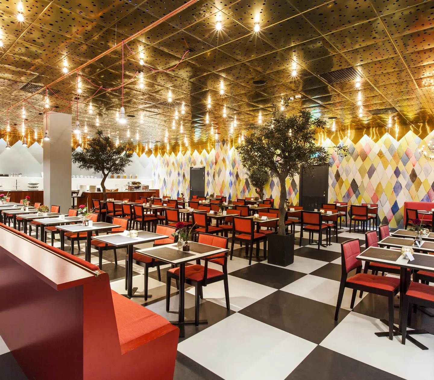 Restaurant with red chairs and checkerboard floor
