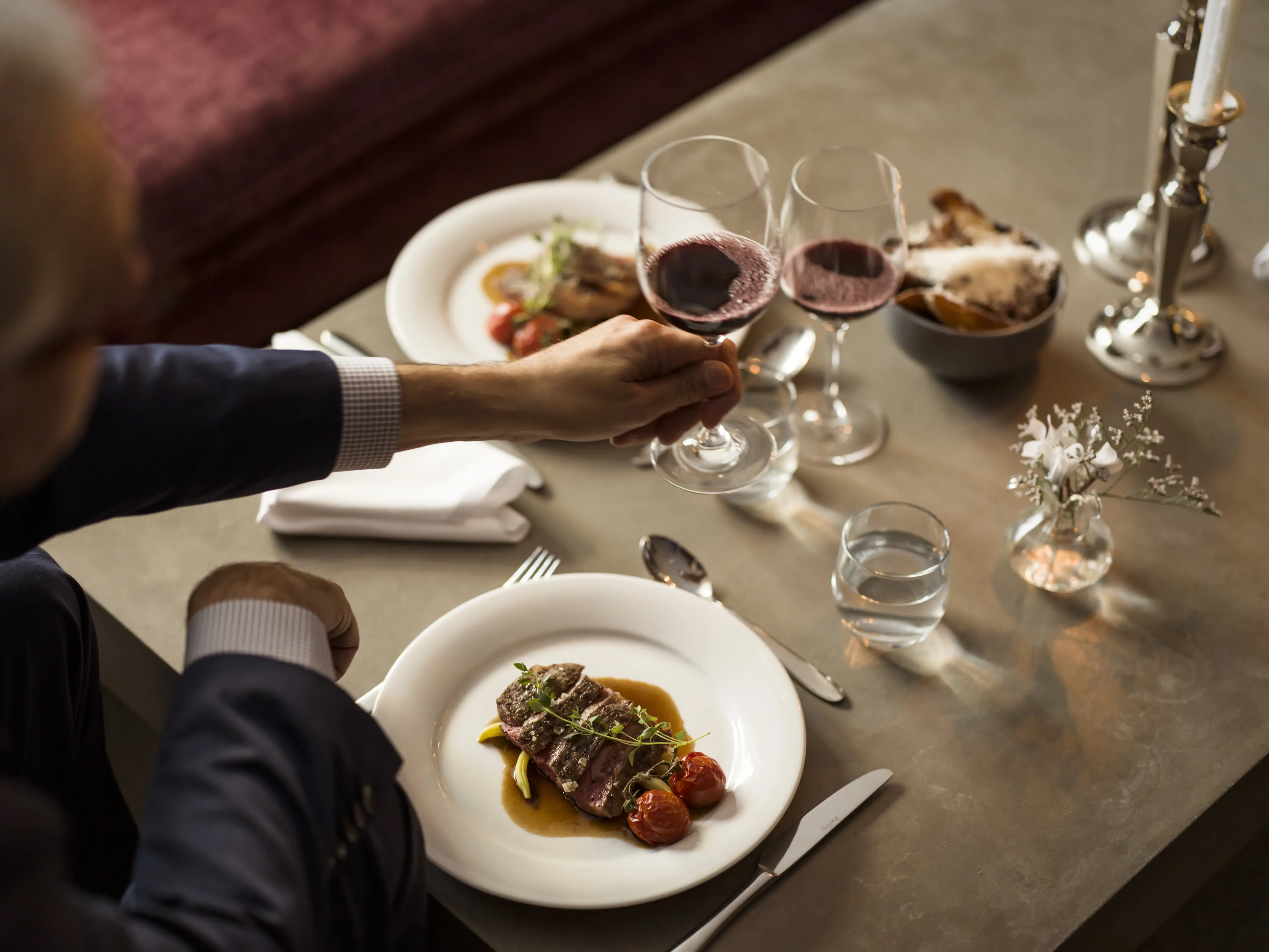 Dinner table with food and wine