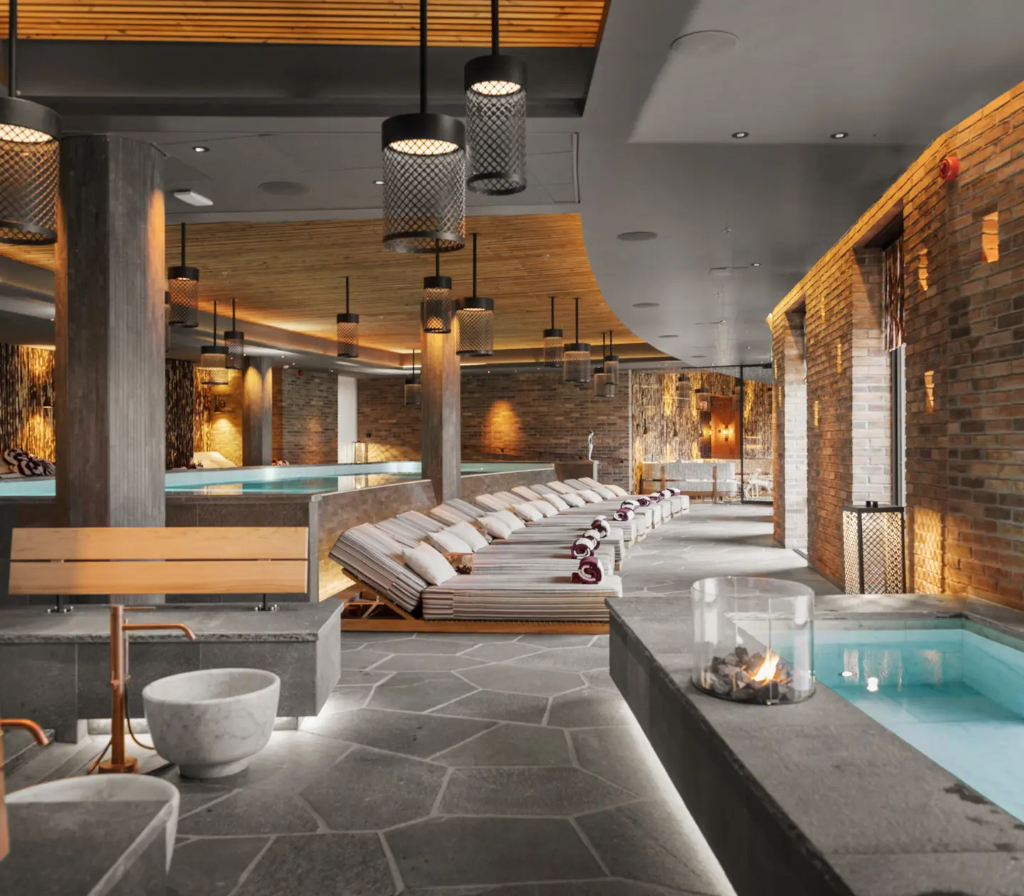 An indoor pool and sunbeds